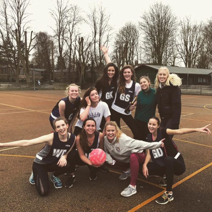 The women's netball cuppers team 2018 posing for a photo on the pitch