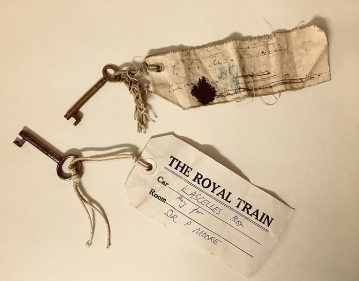 Two small keys, each has a tag attached with string. One is marked "The Royal Train"