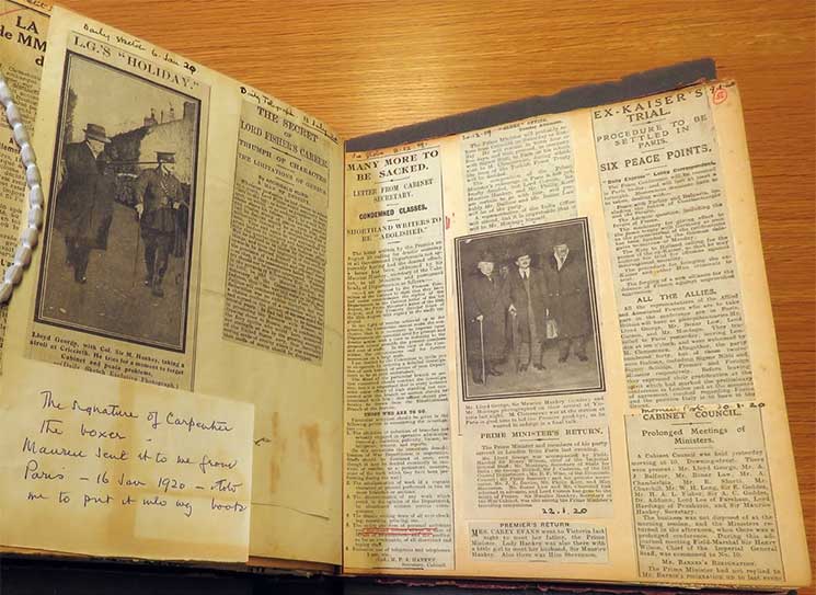 An open scrapbook filled with newspaper clippings