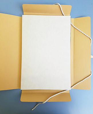 An open four flap folder 