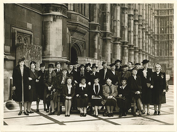 Black and white photograph of women MPs on the House of Commons Terrace.