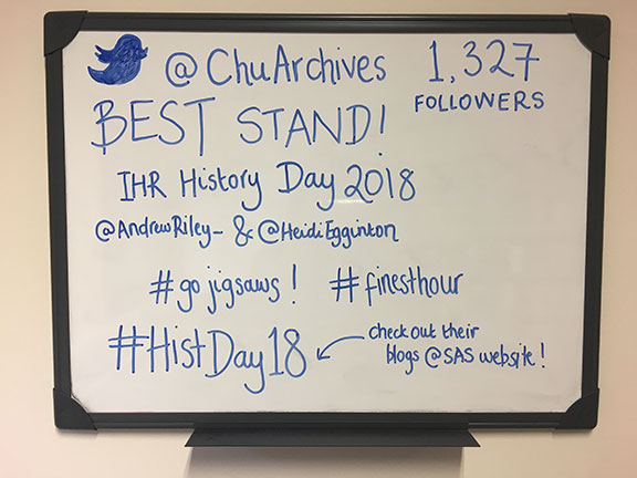 A whiteboard in the Churchill Archives Centre staff tea room, with the announcement "BEST STAND! IHR History Day 2018. #GoJigsaws #FinestHour #HistDay18"