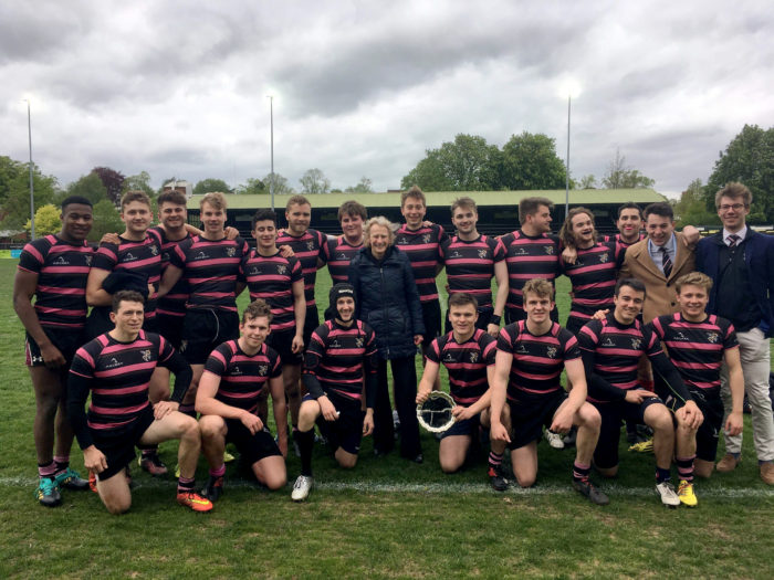 Churchill's Rugby team holding the plate and posing for a photo with Athene Donald