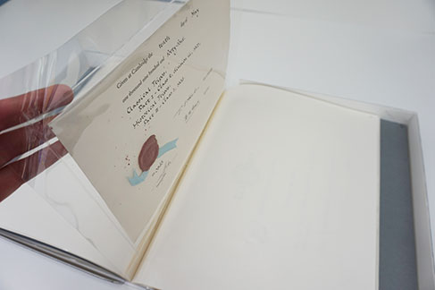 The diploma with its red wax seal has been inserted into a polyester sleeve, which has been bound into the fascicule