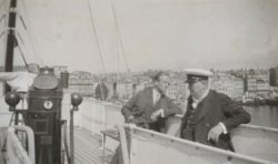 Black and white photo of Lord Moyne and Churchill leaning on the railing of a boat.