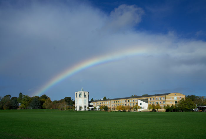 A rainbow spans over the Moller Centre.