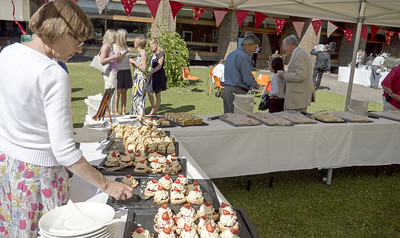 Donor garden party with cream teas under a marquee