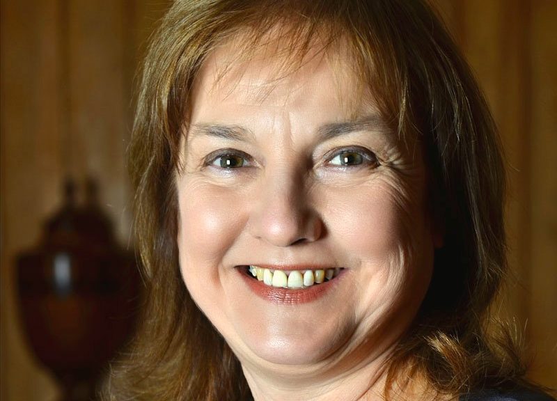 A close-up of a woman smiling.