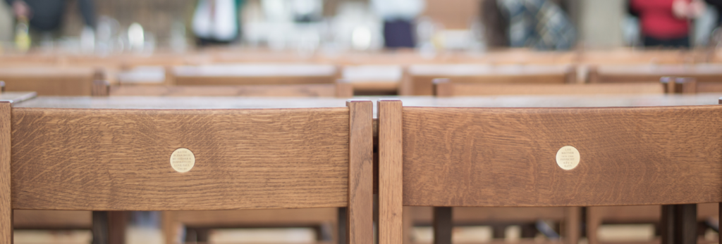 Names chairs with plaques in the Dining Hall