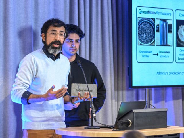 Dr Dushanth Seevaratnam and PhD student Callon Peate, accepting the Trinity Bradfield First Prize for their work on GreenMixes